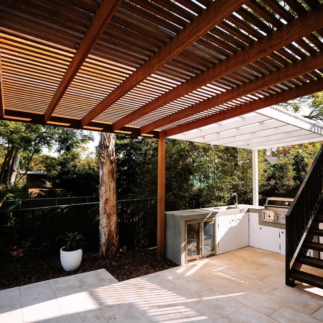 pergola with outdoor kitchen and staircase